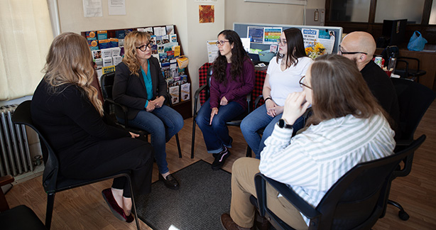 People in chairs at a support group
