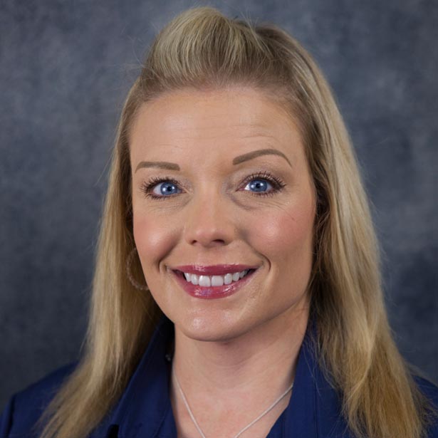 Lindsey Eye headshot with blue background